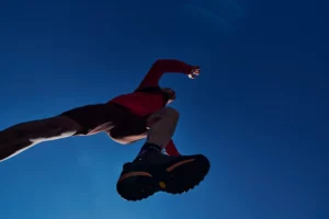 Hiking shoe from a low angle against a blue sky